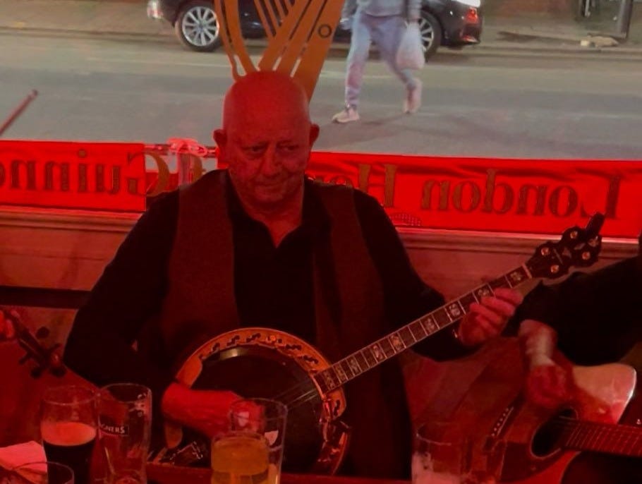 May be an image of 2 people, accordion, guitar and harp