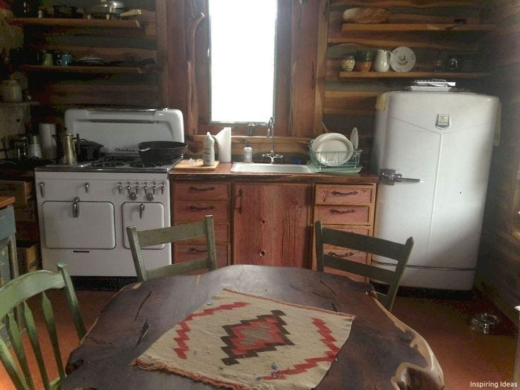 This may contain: a kitchen with an old fashioned stove and table