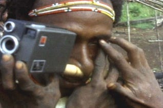 A person holding a camera

AI-generated content may be incorrect.