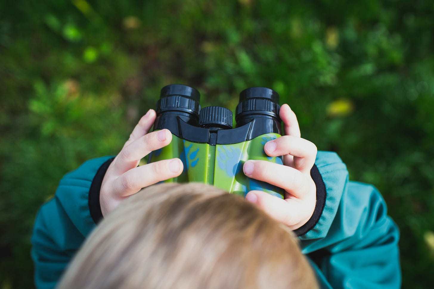 child with binoculars child with binoculars