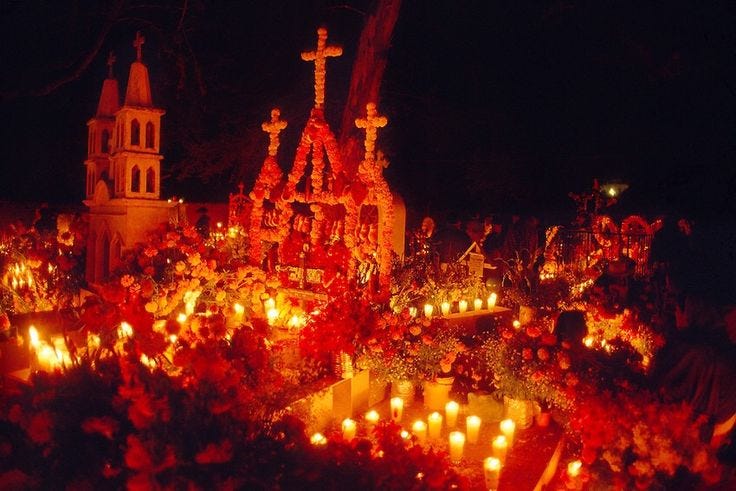 This may contain: many candles are lit in front of a church This may contain: many candles are lit in front of a church