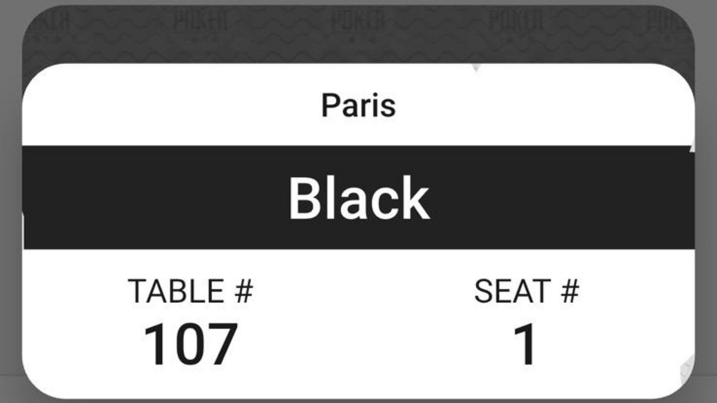 A digital image showing Katlyn Slone’s World Series of Poker seat assignment for Day 1: Paris casino, Black section, Table 107, Seat 1.