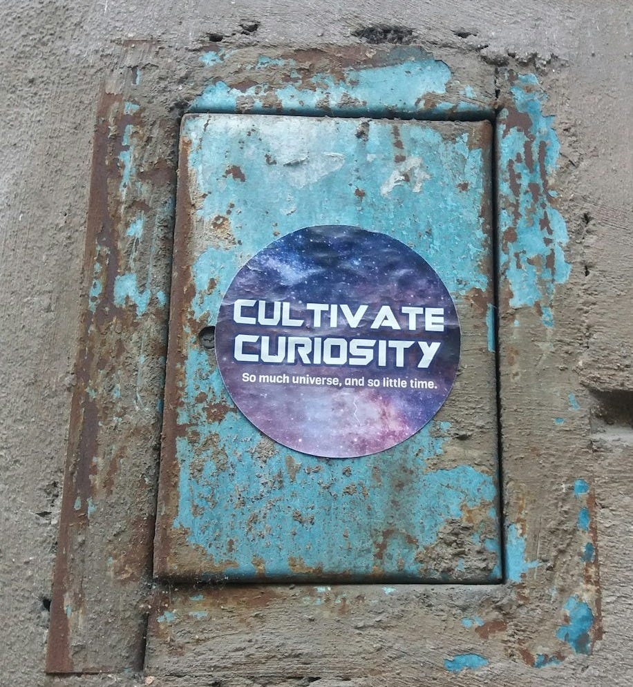 a rusted out sign on the side of a building a rusted out sign on the side of a building
