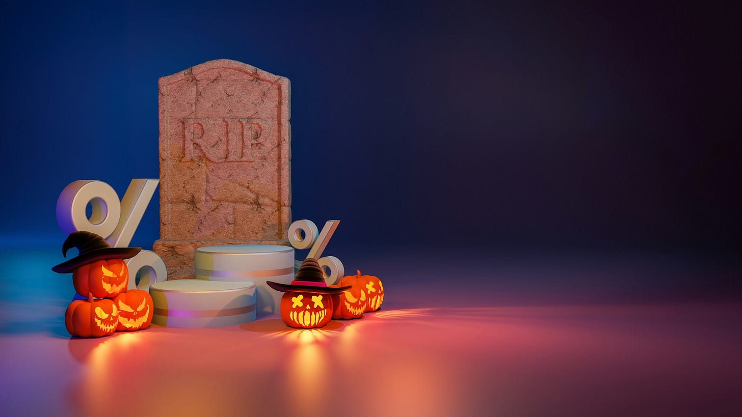 Halloween-themed still life with glowing jack-o'-lanterns, percentage symbols and a gravestone marked "RIP," symbolizing scary financial habits and rising interest rates. Photo by Eyestetix Studio on Unsplash