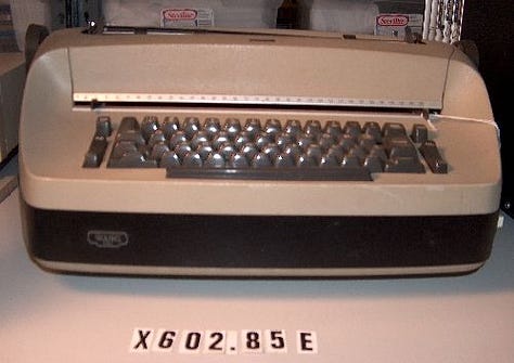 An advertisement for a calculator and then the typewriter.