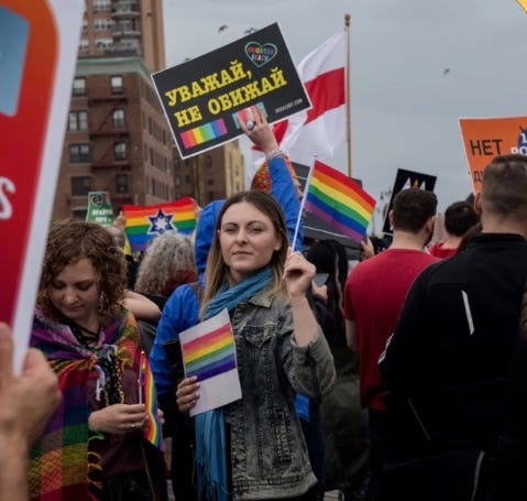 A group of people holding signs

AI-generated content may be incorrect.