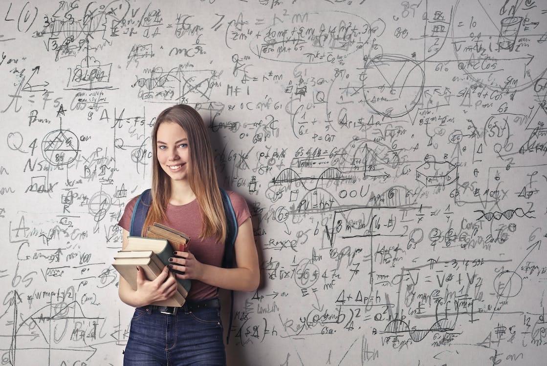 Free Woman Holding Books Stock Photo