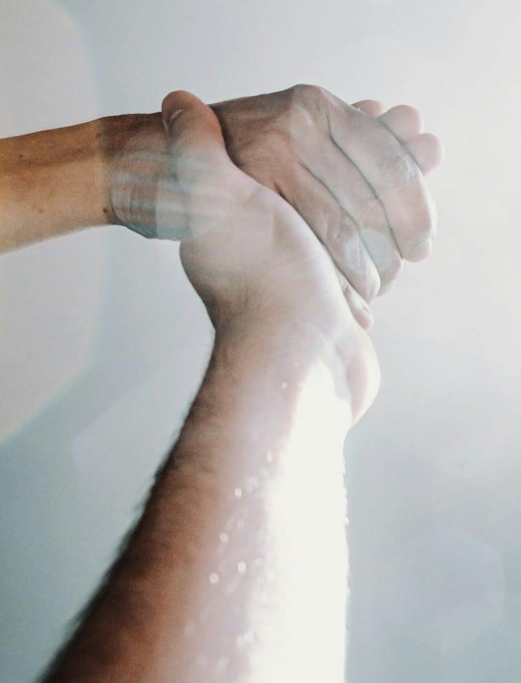 person holding out right hand