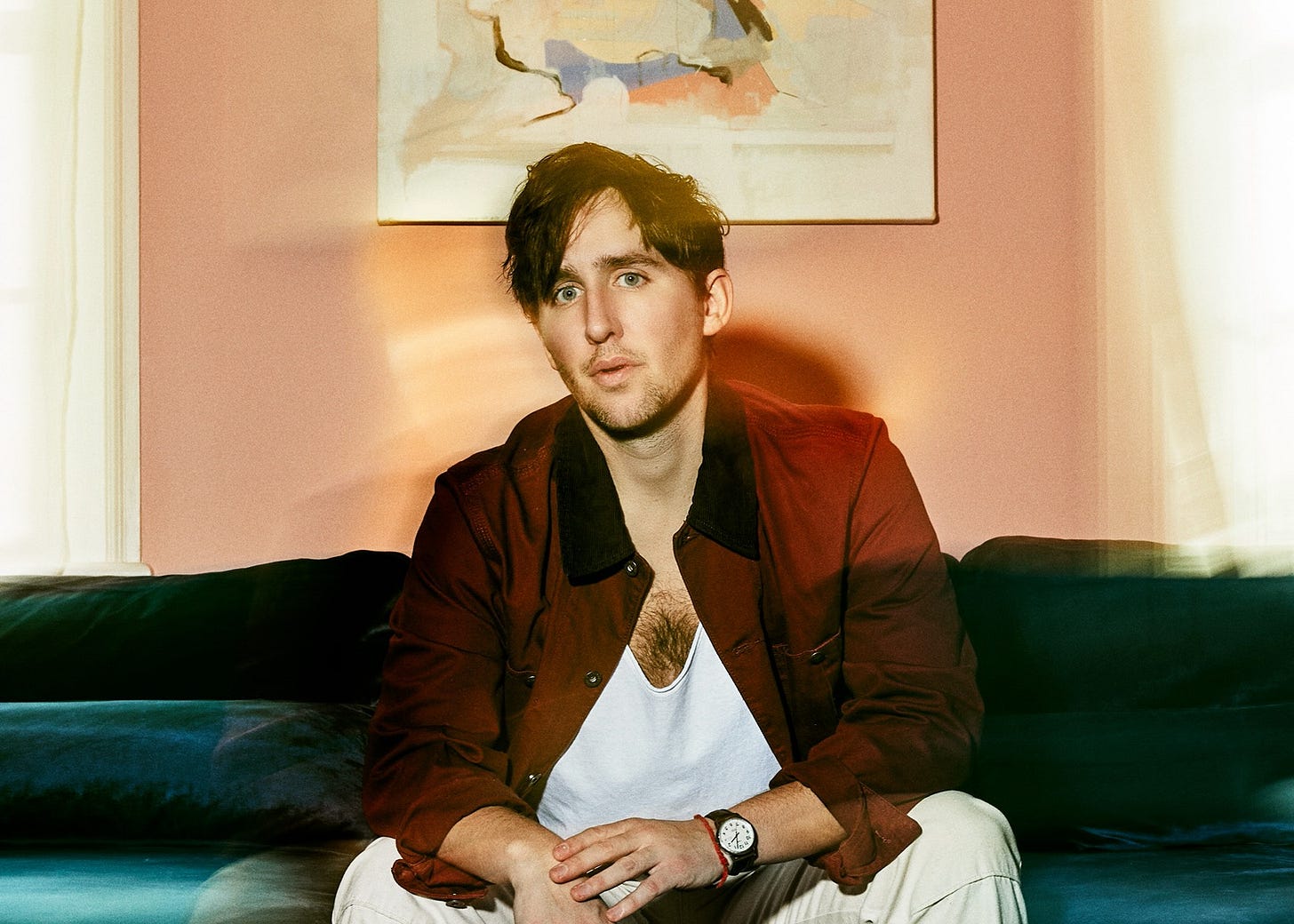 A man sitting on a sofa A man sitting on a sofa