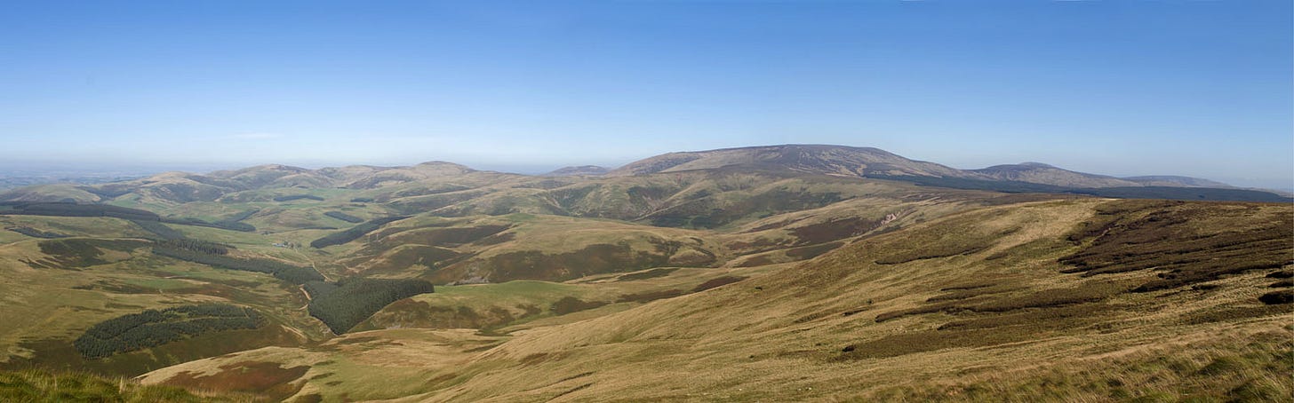 green valley on left, hills rising on right green valley on left, hills rising on right