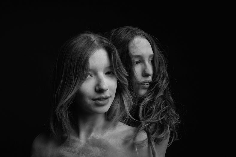 Black and white photo of the same woman with two different versions of her face — one younger than the other. The woman has medium length hair Black and white photo of the same woman with two different versions of her face — one younger than the other. The woman has medium length hair