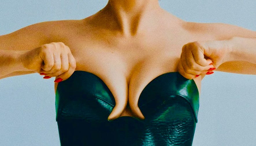 image of woman wearing a green bustier