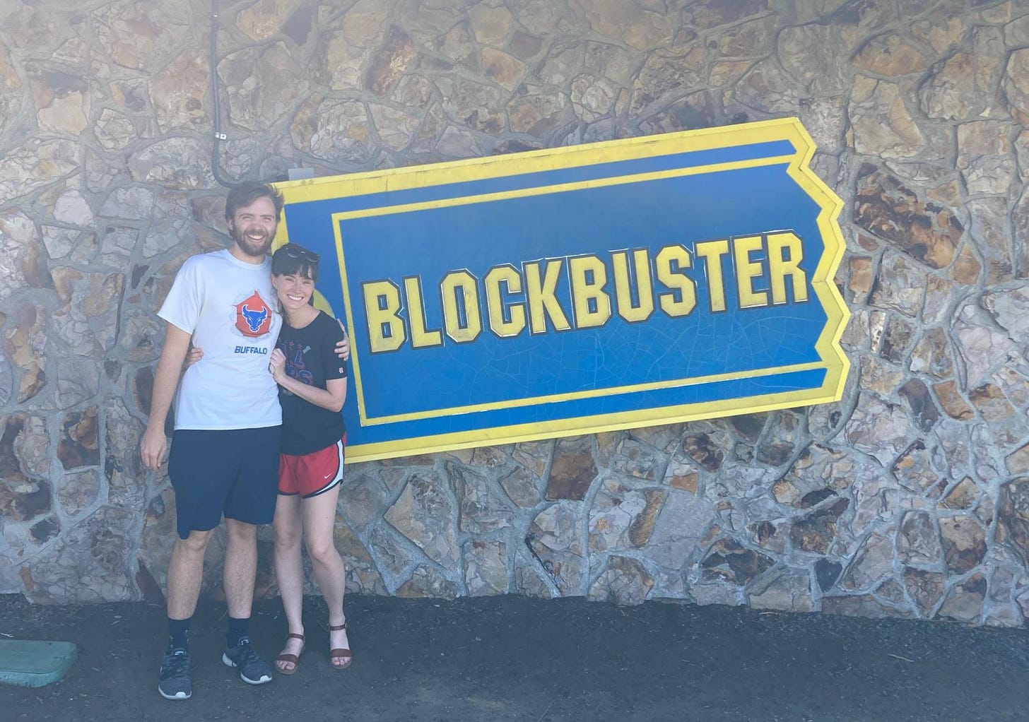 Couple standing outside Blockbuster Couple standing outside Blockbuster