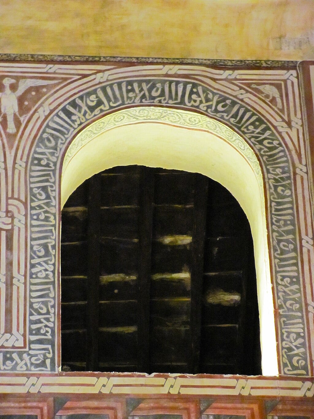 Pseudo-Arabic (i.e. not Kufic style) surrounding an interior window of the Church of San Román, Toledo, Spain (c. 1221)