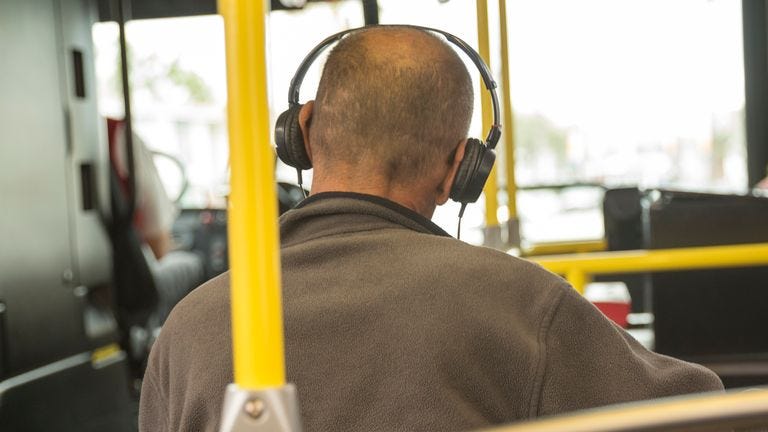 Man listens to music on bus. File pic: iStock Man listens to music on bus. File pic: iStock