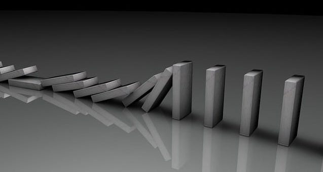 Unlabeled dominoes falling in series. Unlabeled dominoes falling in series.