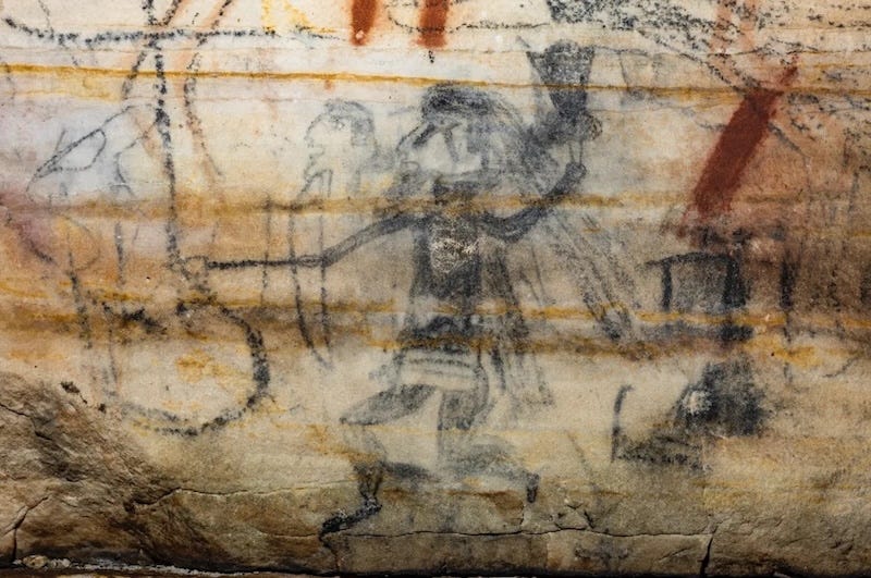 A warrior figure in Picture Cave, holding a mace, bow and arrows. Photo Mike Chervinko. A warrior figure in Picture Cave, holding a mace, bow and arrows. Photo Mike Chervinko.