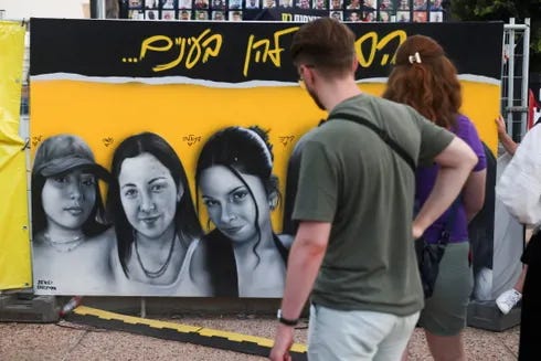 A photo of the kidnapped female IDF spotters in Tel Aviv.