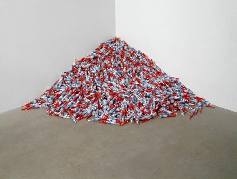 A mound of blue and red lollipops is placed in a corner.