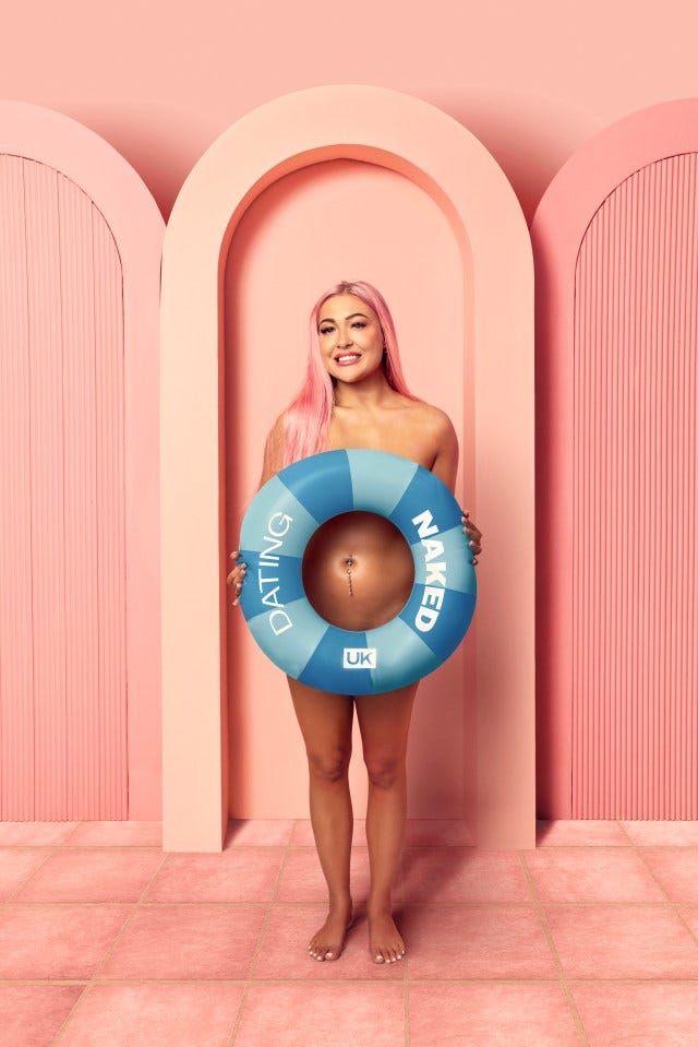 Woman holding a life preserver that says "Dating Naked UK."