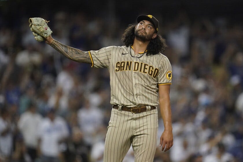 Padres starting pitcher Sean Manaea reacts after giving up a three-run homer to the Dodgers' Mookie Betts Padres starting pitcher Sean Manaea reacts after giving up a three-run homer to the Dodgers' Mookie Betts