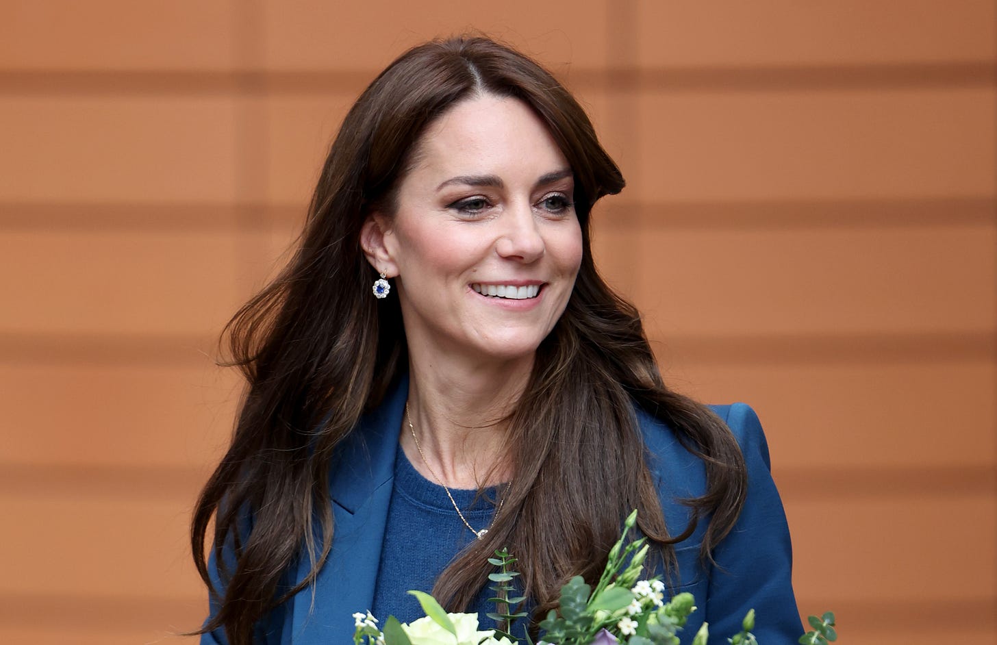 princess kate smiling with hair down wearing blue