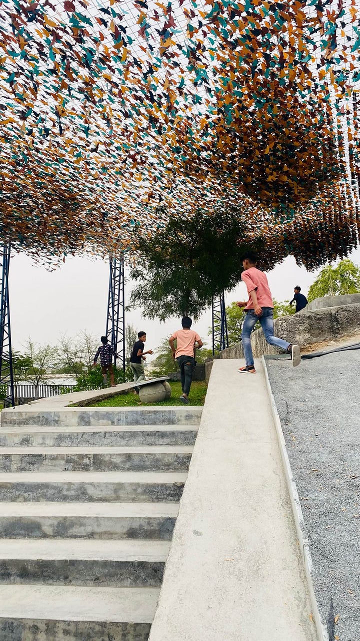 Children playing on swings at Udaan Park, Udaipur, Rajasthan