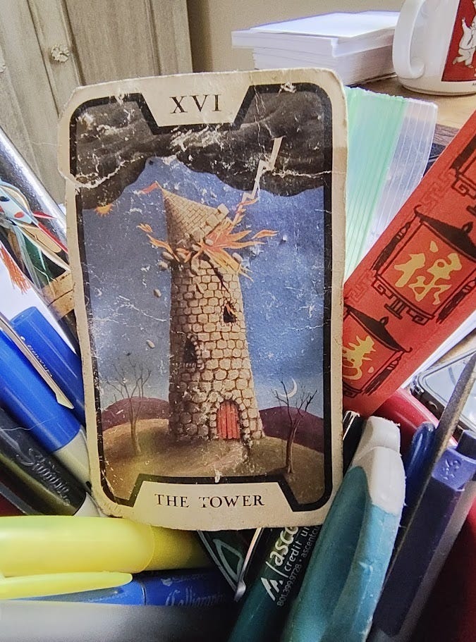 A picture of a crumpled Tower card from the Tarot Of The Witches deck