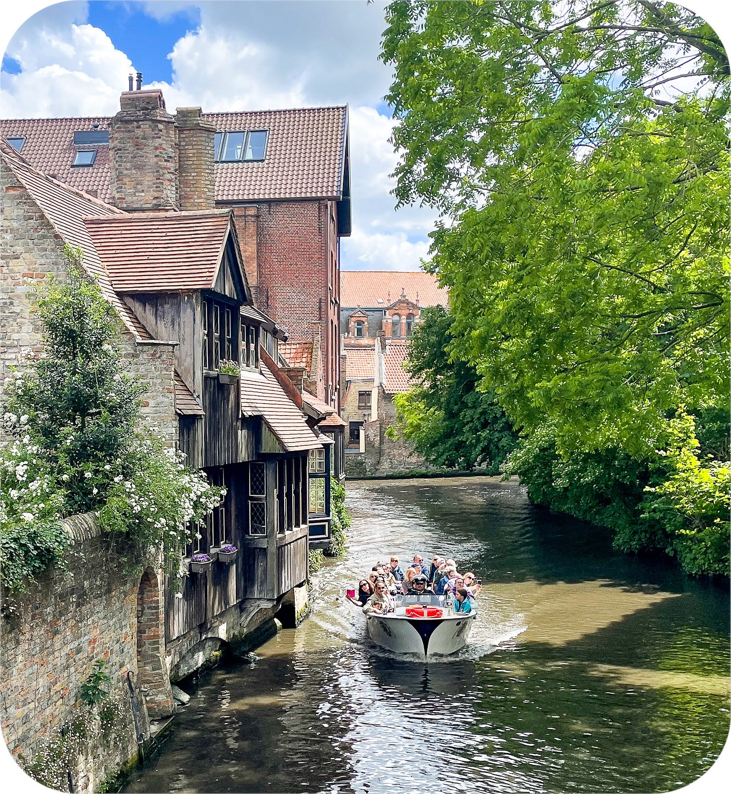 Tourist boat on canal, Bruges, Belgium