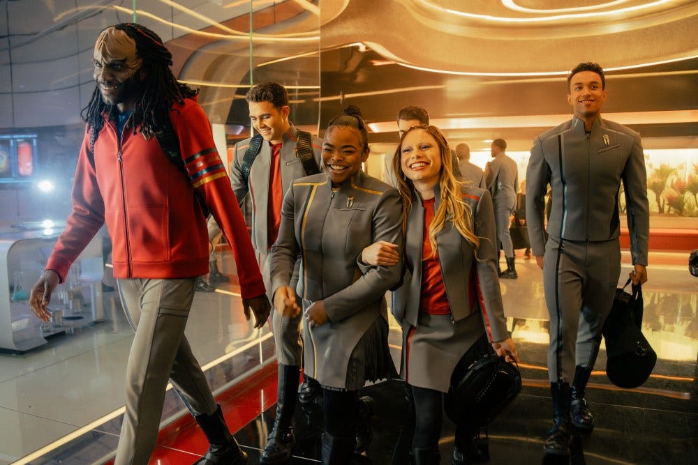 L-R: Karim Diané as Jay-Den, George Hawkins as Darem, Kerrice Brooks as SAM, Bella Shepard as Genesis, and Sandro Rosta as Caleb in season 1, episode 5, of Star Trek: Starfleet Academy streaming on Paramount+. Photo Credit: John Medland/Paramount+