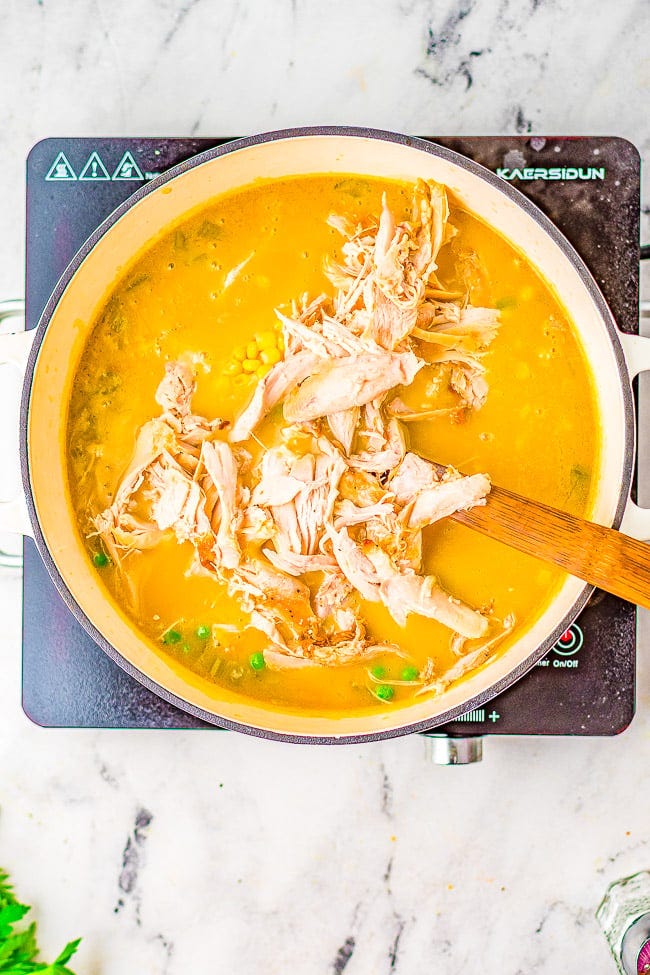 Chicken Pot Pie Soup - All the comfort food feels of pot pie, but in soup form! Rich, hearty, creamy and ready in just 30 minutes! Use canned biscuit dough to save time on busy weeknights when you're craving a hot homemade meal!