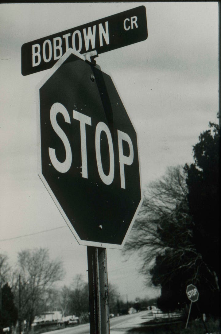 Left: Bobtown Circle stop sign, 1987. Right: Roland Charles stands next to a stop sign in Bobtown. Roland Charles Collection © Tom and Ethel Bradley Center.