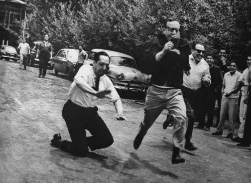 Salvador Allende competes in an impromptu race against Senator Armando Jaramillo. Chile. 1965.
