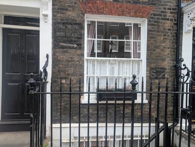 A black iron fence next to a window

AI-generated content may be incorrect.