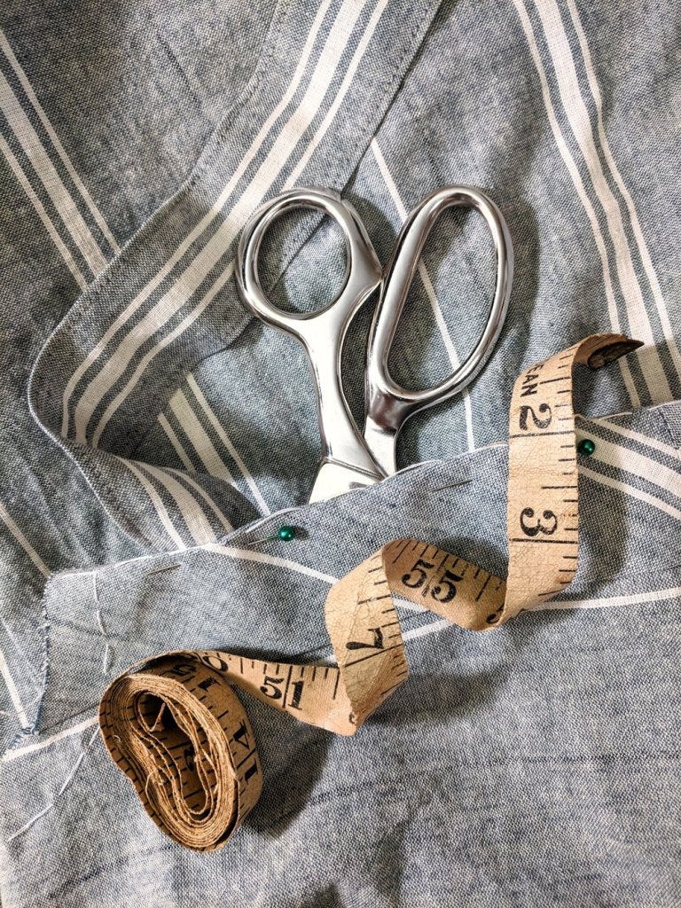Fabric shears and tape measure with the in-progress bodice
