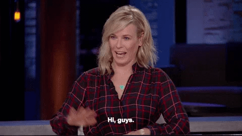 A woman waves and text says hi guys A woman waves and text says hi guys