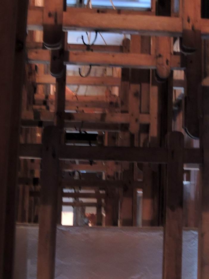 A close-up of a wooden structure

AI-generated content may be incorrect.