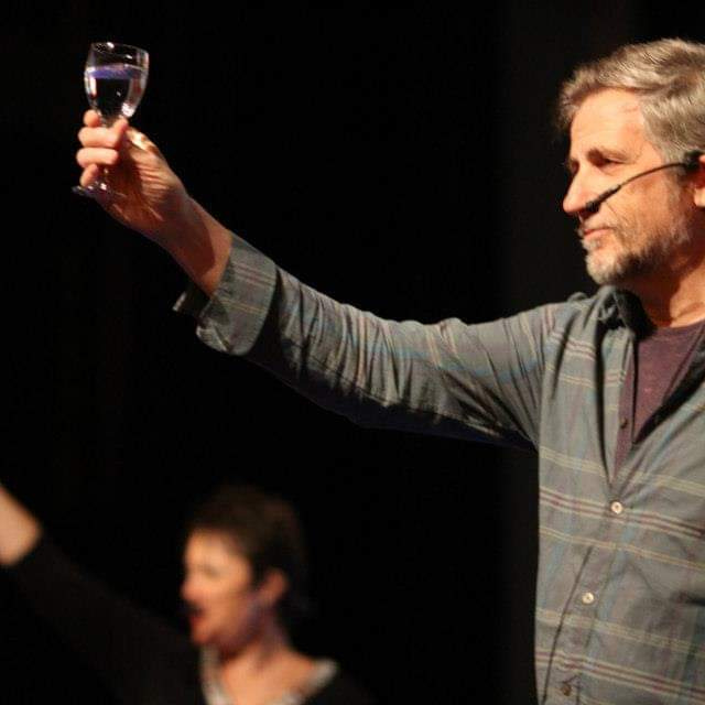 Lyssa Adkins and Michael Spayd raise a glass to the crowd in Ukraine