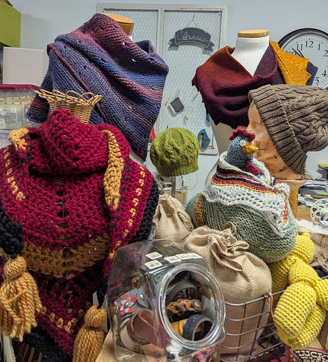 Three pictures of the inside of the 614 Knit Studio. One of knit samples, one of Chase Harpole’s trunk show, and one of a yarn shelf.
