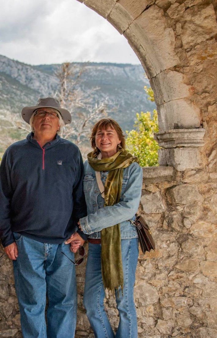 A person and person standing in a stone arch

AI-generated content may be incorrect.