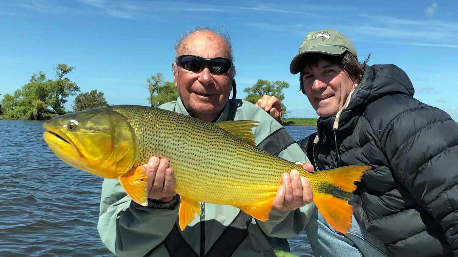 Ira Drogran at age 85 with nice-sized golden dorado during a Fishing with Larry hosted week with host Brad Staples.