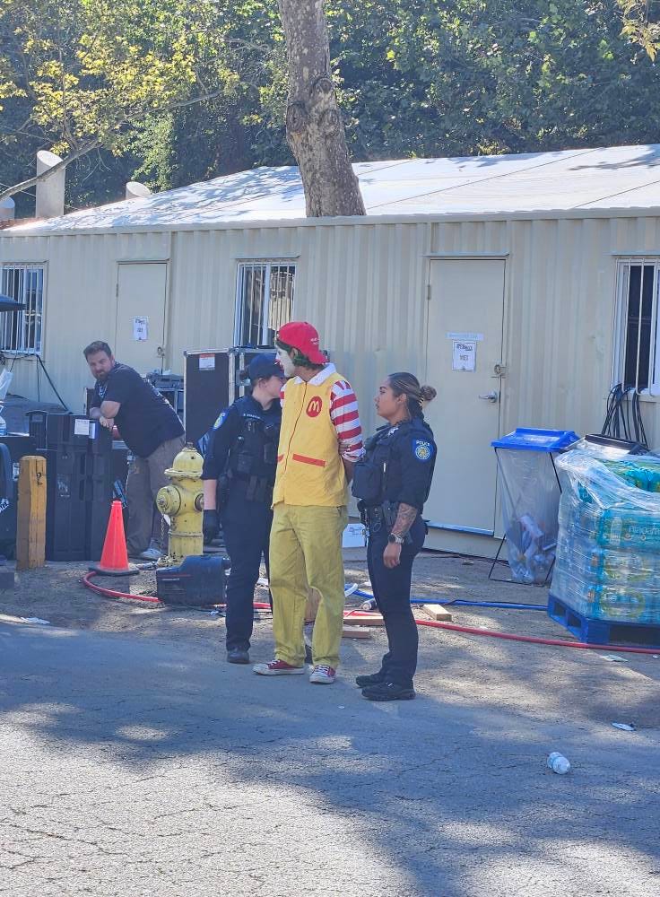 May be an image of 4 people and ambulance