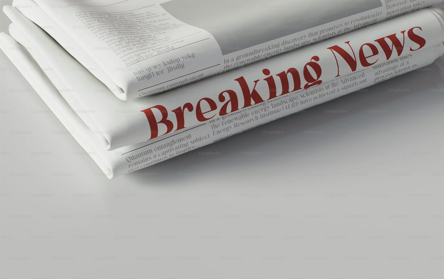 a stack of newspapers sitting on top of each other a stack of newspapers sitting on top of each other