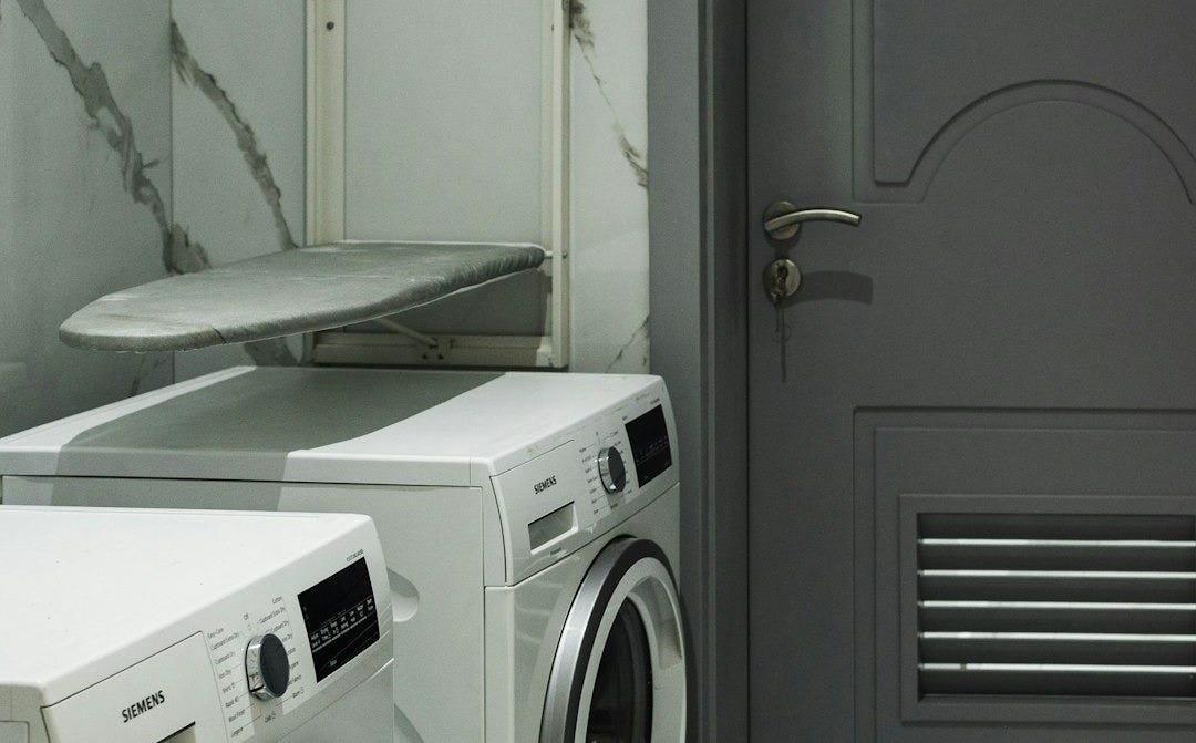 a washer and dryer sitting next to each other
