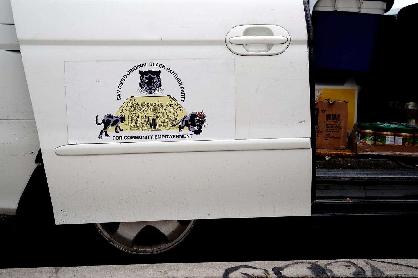 Food for distribution to people experiencing homelessness is seen inside a minivan displaying a San Diego Original Black Panther Party for Community Empowerment magnet, in San Diego, California, on May 25, 2022. Food for distribution to people experiencing homelessness is seen inside a minivan displaying a San Diego Original Black Panther Party for Community Empowerment magnet, in San Diego, California, on May 25, 2022.