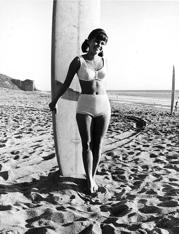 Actress Sally Field, as 'Gidget,' posing with a surfboard on the beach, circa 1965. Actress Sally Field, as 'Gidget,' posing with a surfboard on the beach, circa 1965.