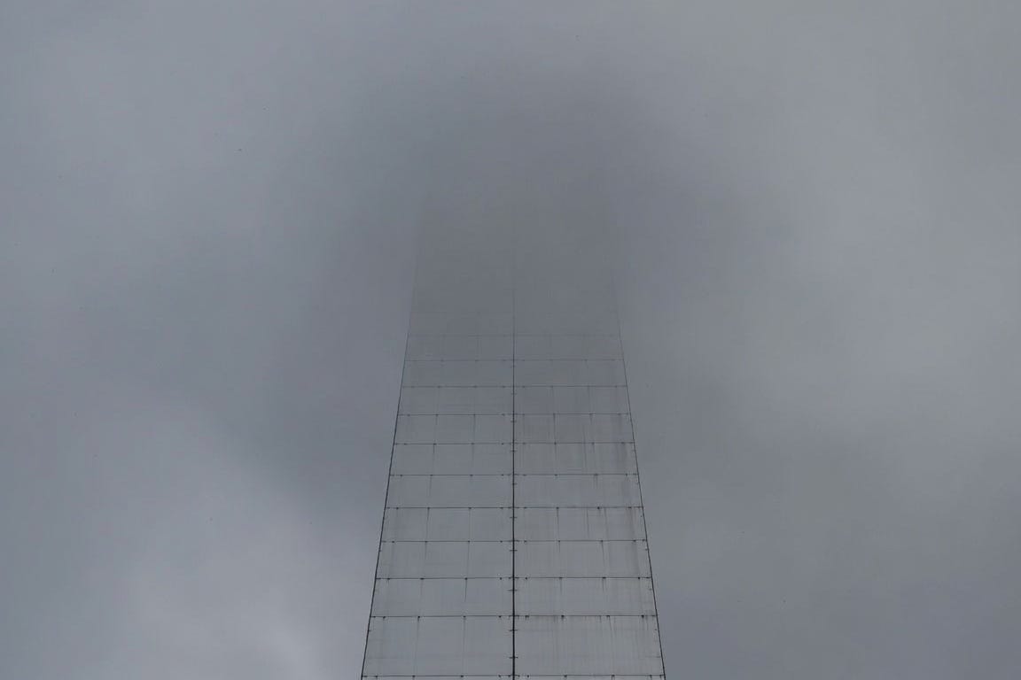 A sky high wall with no purchase for climbing where you cannot see the top