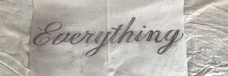 This may contain: the word everything is written in cursive black ink on a white paper towel