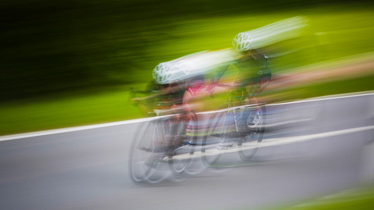 Two road race cyclists.