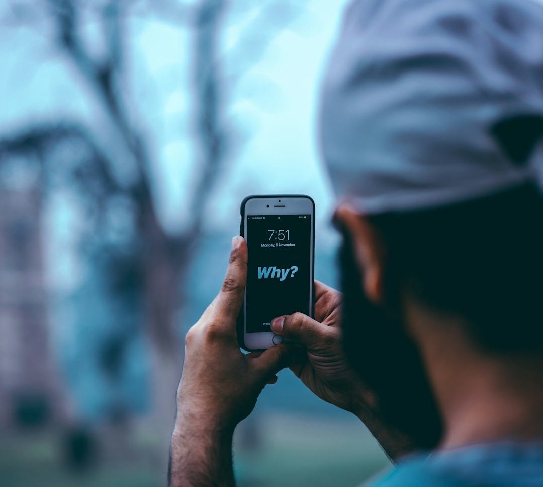 man using silver iPhone 6